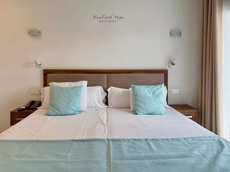 Portodrach Aparthotel 臥室雙人床